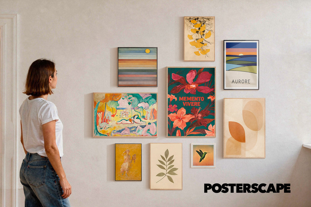 Gallery wall of framed Posterscape posters, from a Matisse print to botanical and abstract art, in a bright living room.