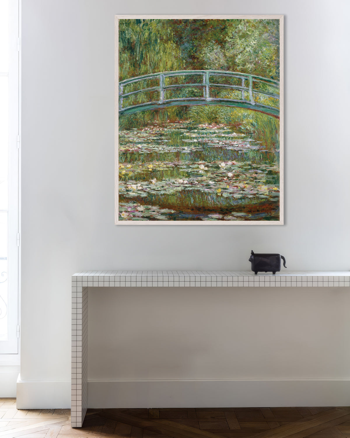 Poster of Bridge over a Pond of Water Lilies (1899) by Claude Monet, with white wooden frame