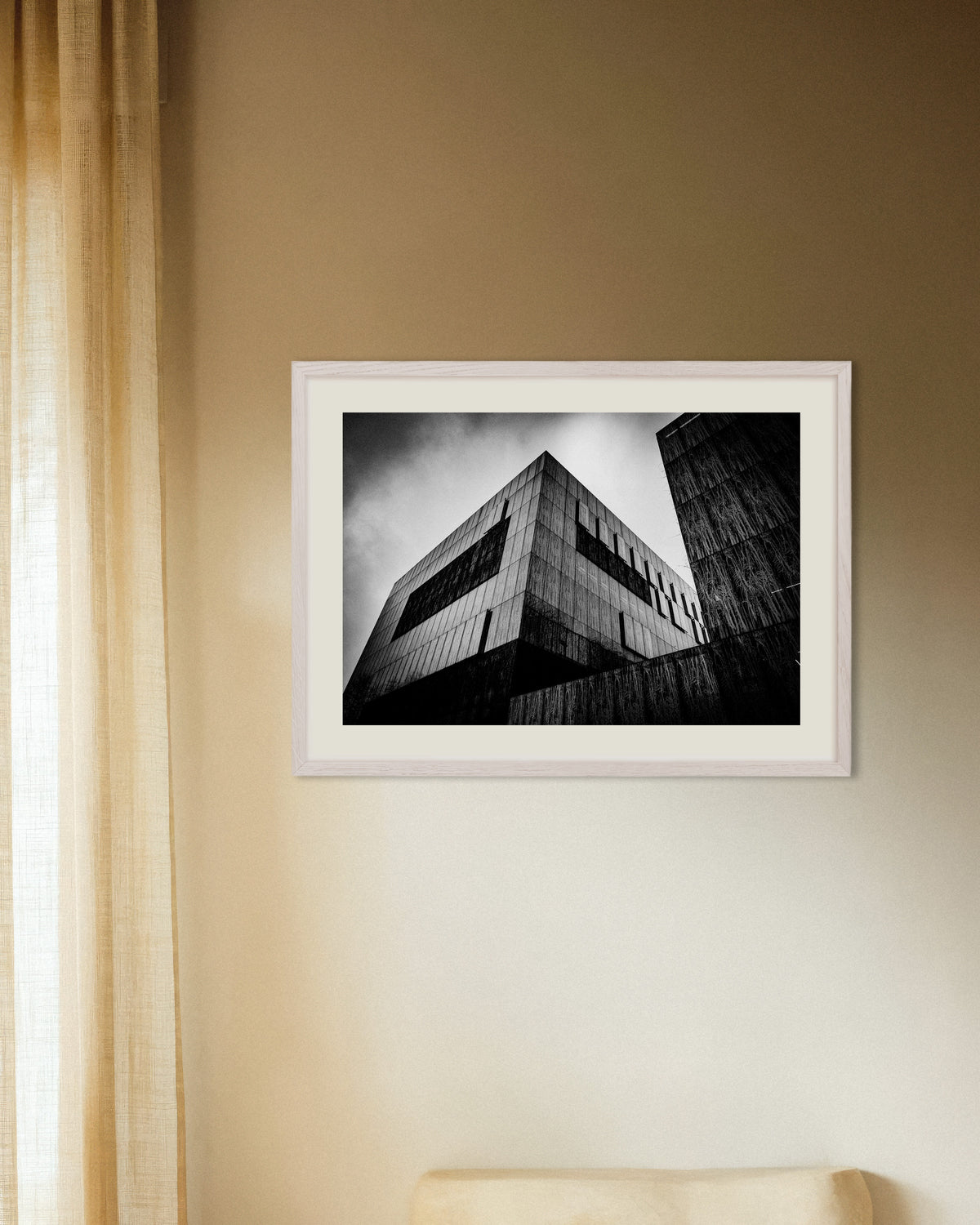 Poster of Dark Concrete Box Under Clouds, with white wooden frame