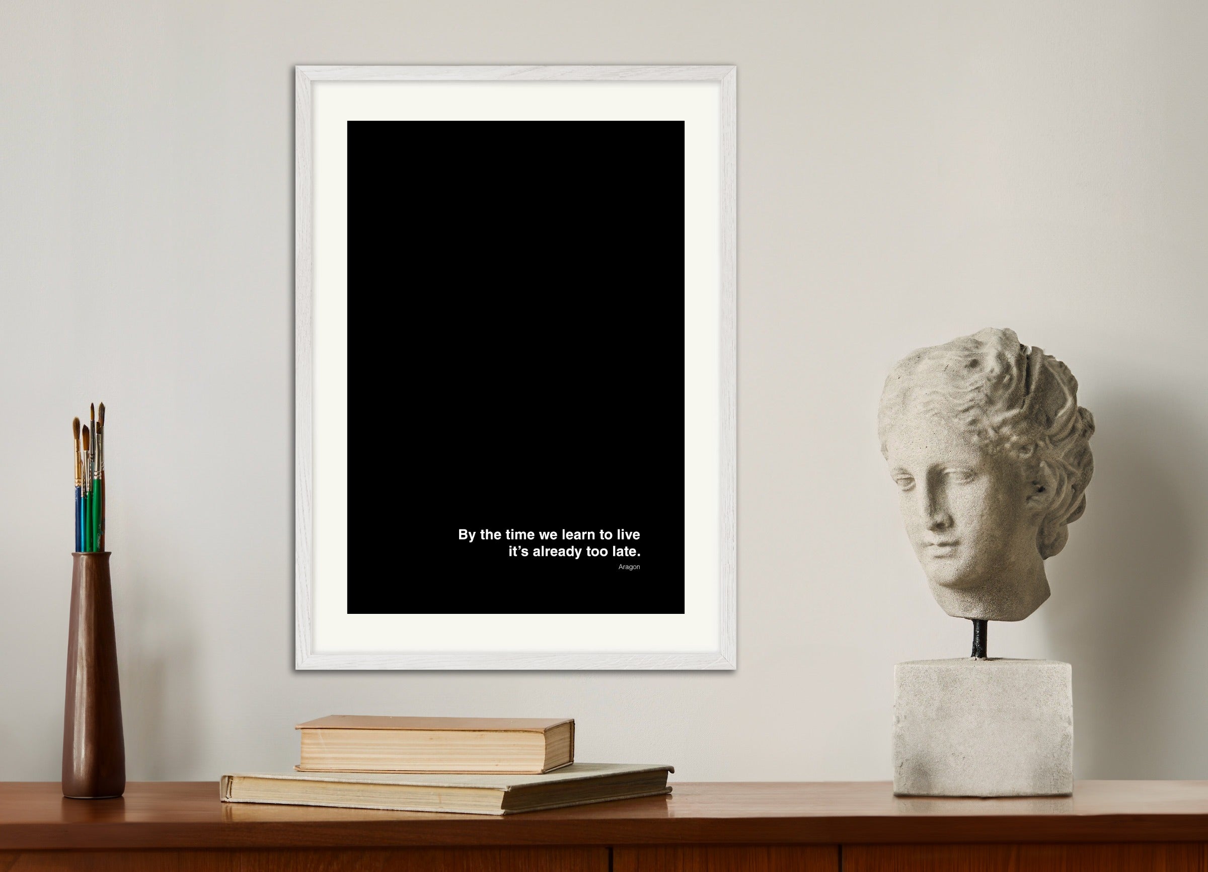 Poster with white wood frame: By the time we learn to live, it's already too late - Aragon