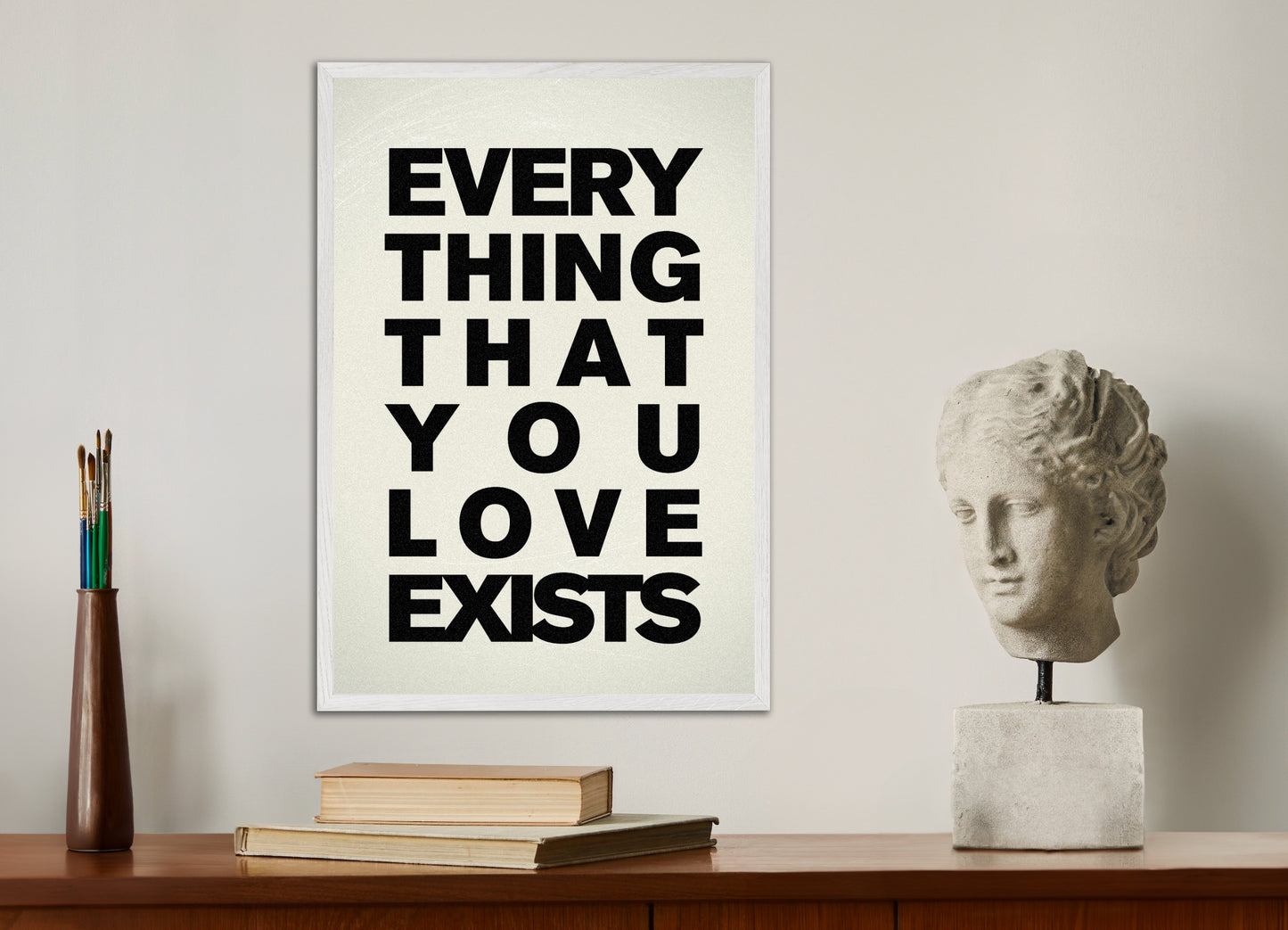 Poster with white wood frame: Everything that you love exists