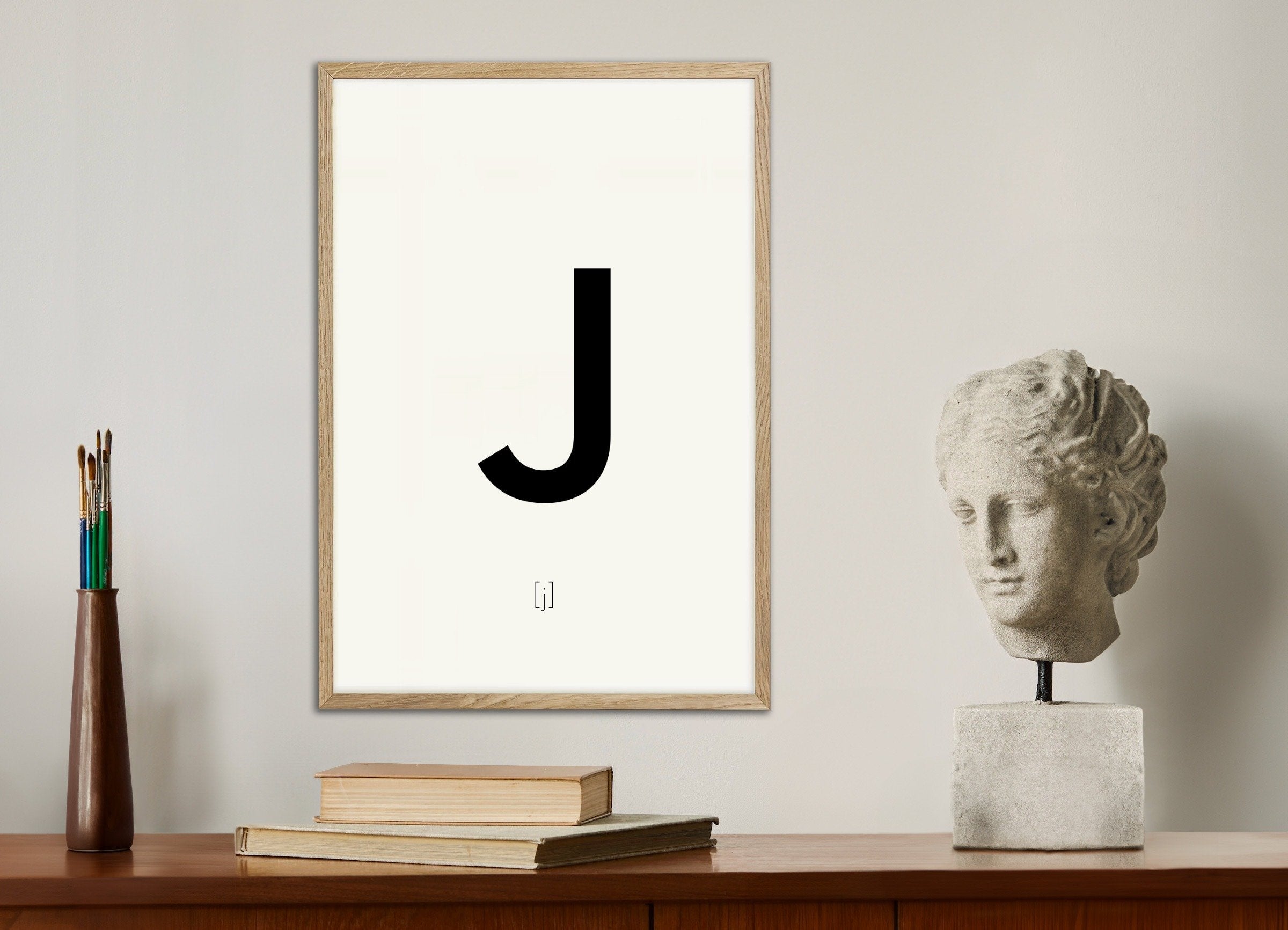 Poster of Letter J, with natural wooden frame