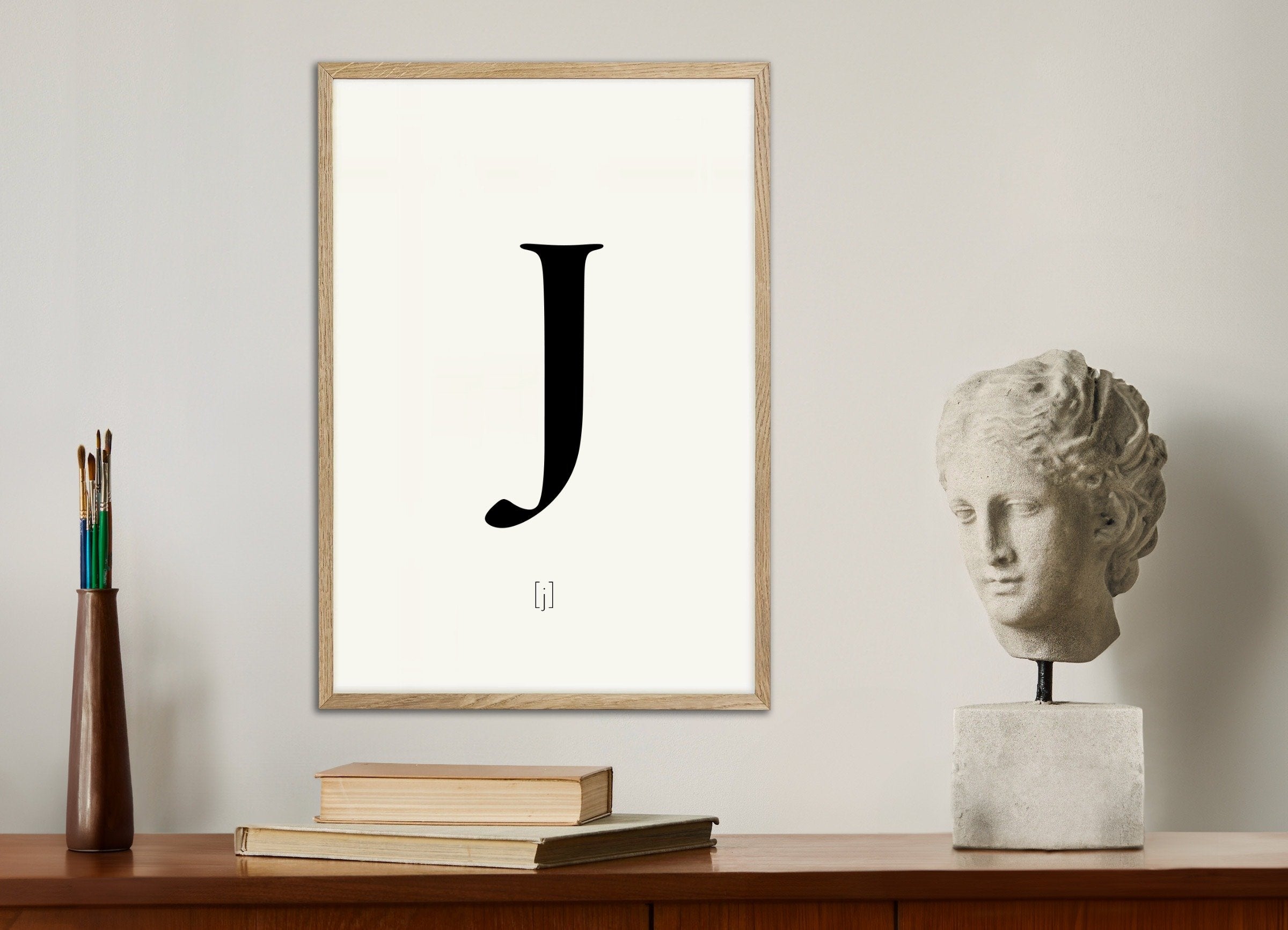 Poster of Letter J, with natural wooden frame